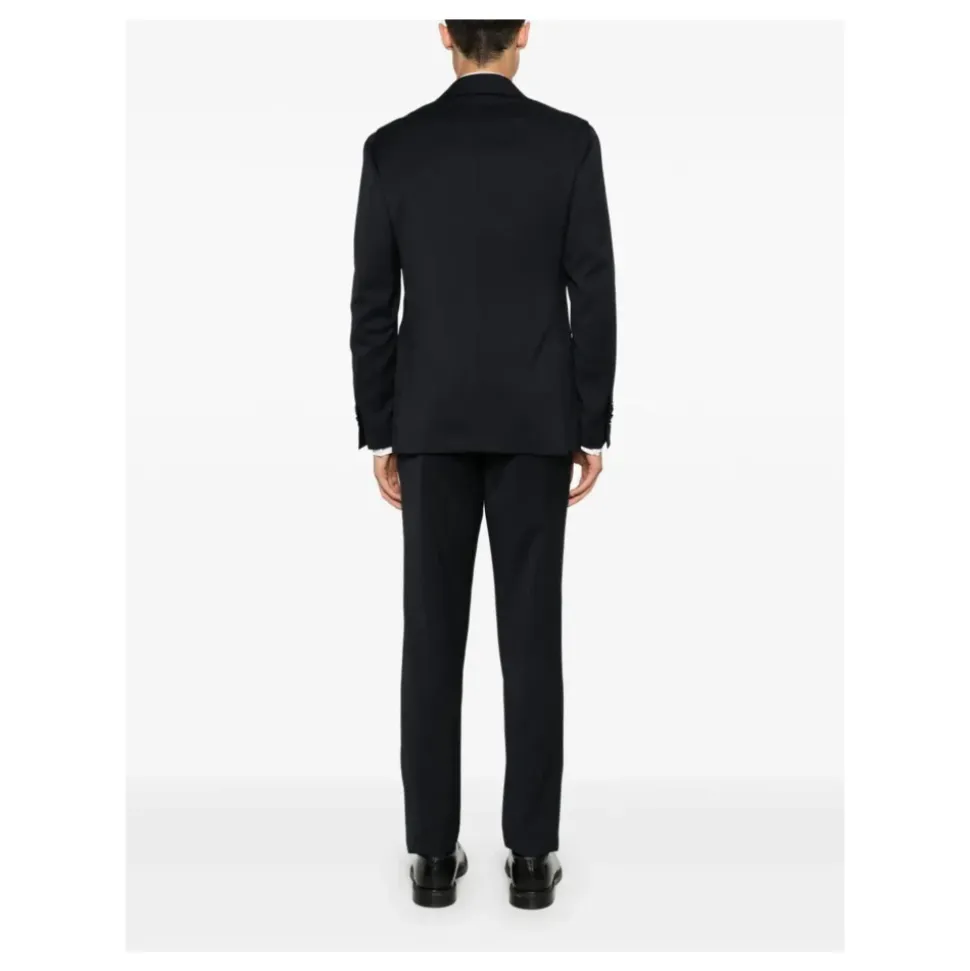 Blå ull dress med brosjedetalj